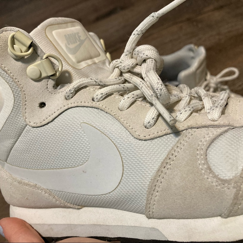gray and white Nike sneakers